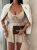 beżowy krótki elegancki kombinezon damski na cienkich ramiączkach ze spódnico-spodenkami i paskiem