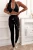 czarny sportowy komplet top z głębokim dekoltem i legginsy modelujące push-up