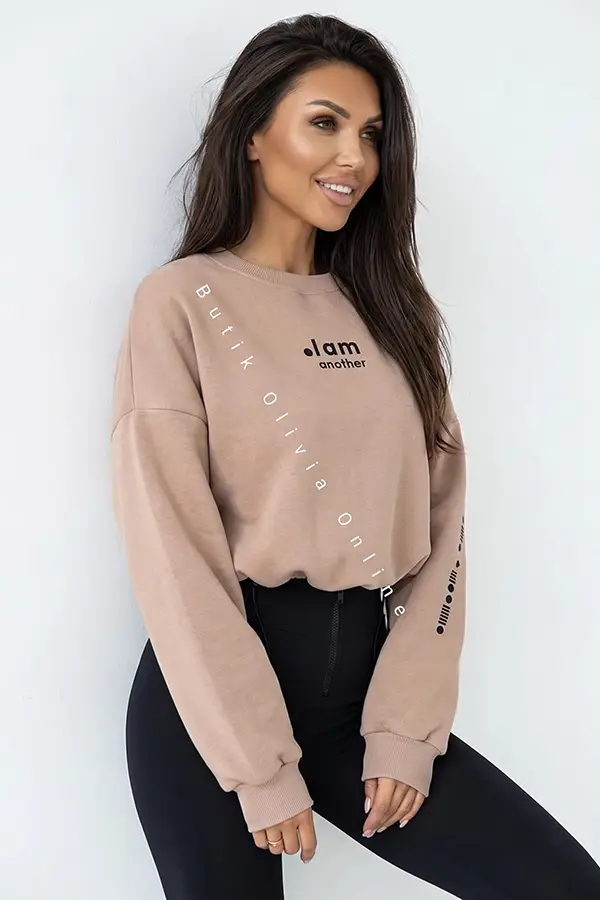 damski komplet beżowa bluza oversize i czarne legginsy z wysokim stanem oraz zamkiem z przodu