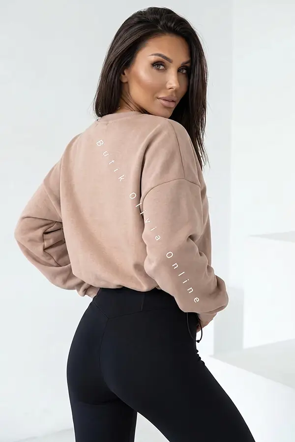 damski komplet beżowa bluza oversize i czarne legginsy z wysokim stanem oraz zamkiem z przodu