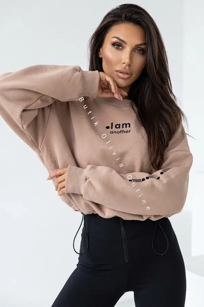 damski komplet beżowa bluza oversize i czarne legginsy z wysokim stanem oraz zamkiem z przodu